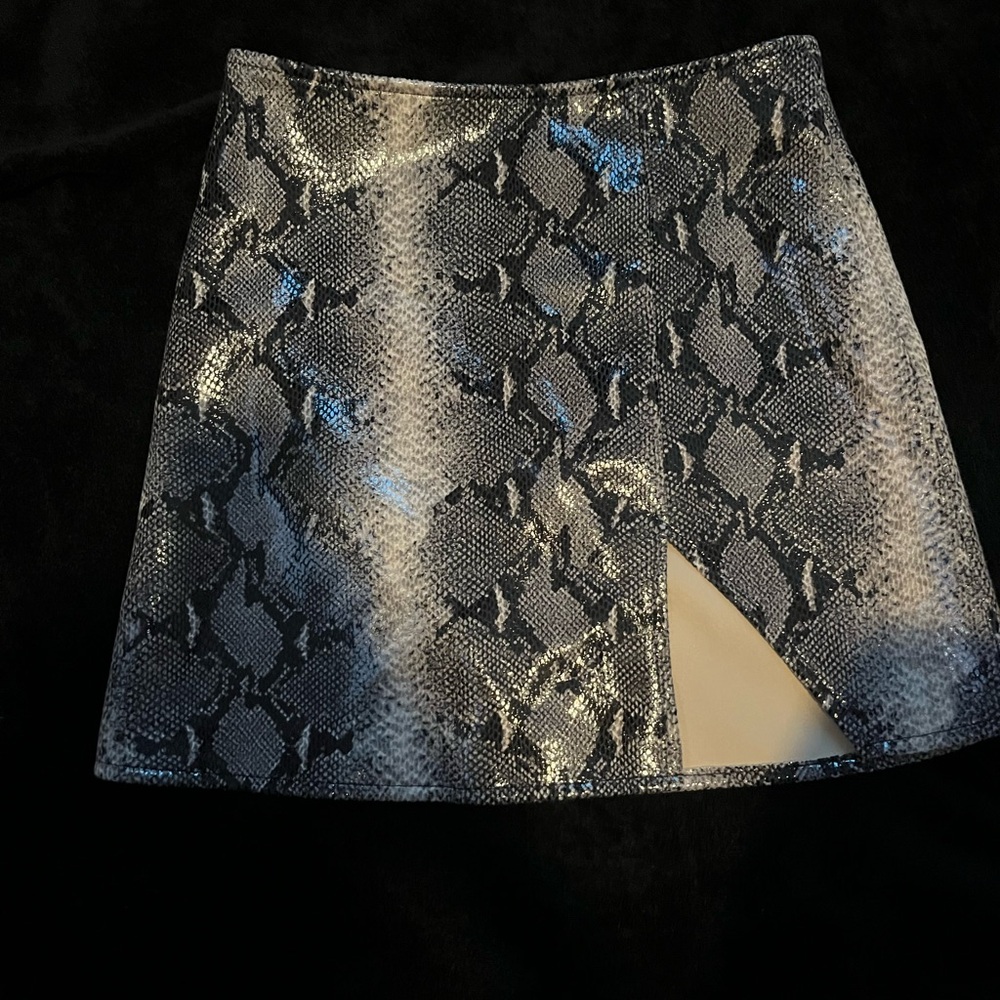 Motel Rocks snake print mini skirt.